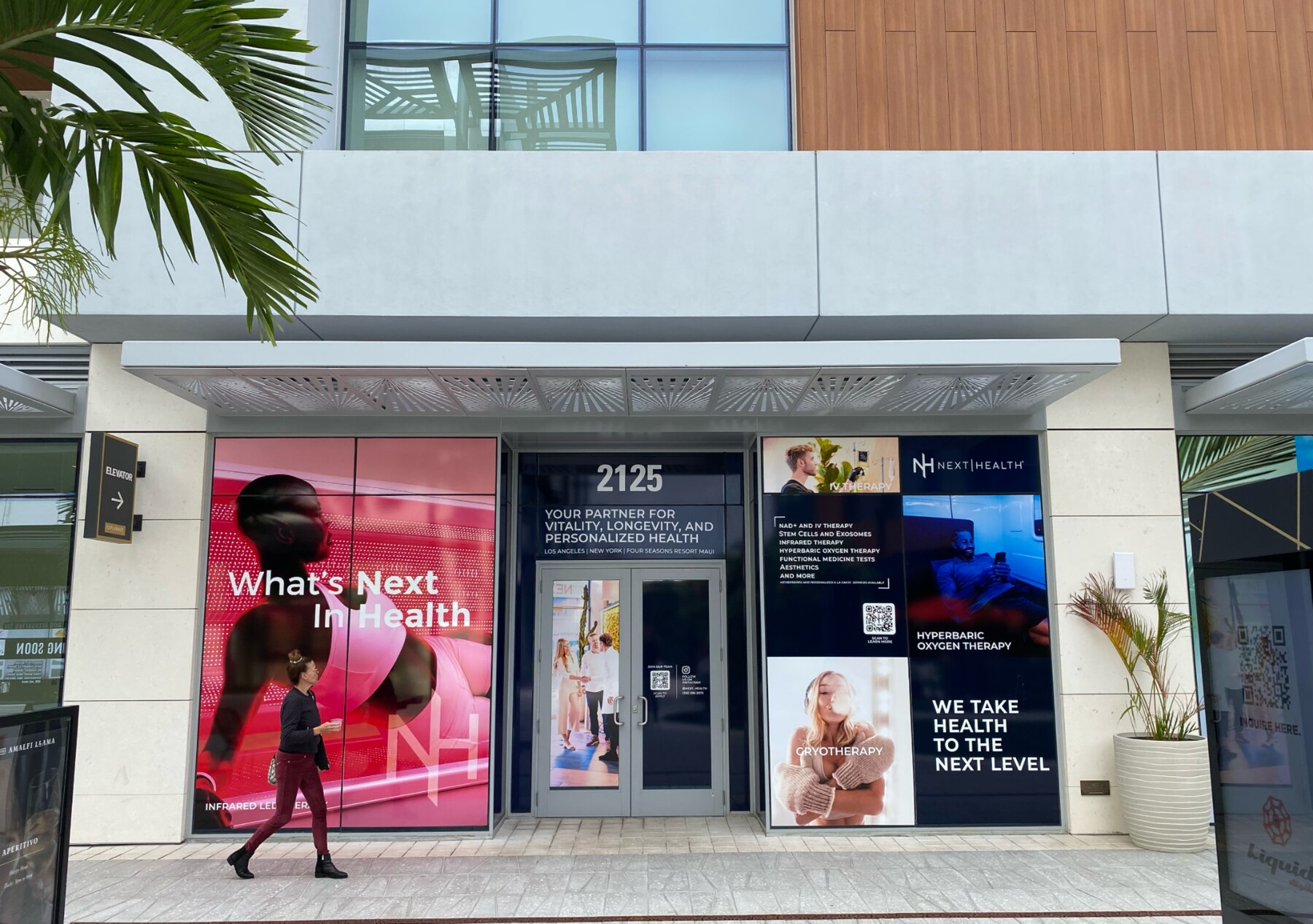 Next Health storefront takeover with branded window graphics